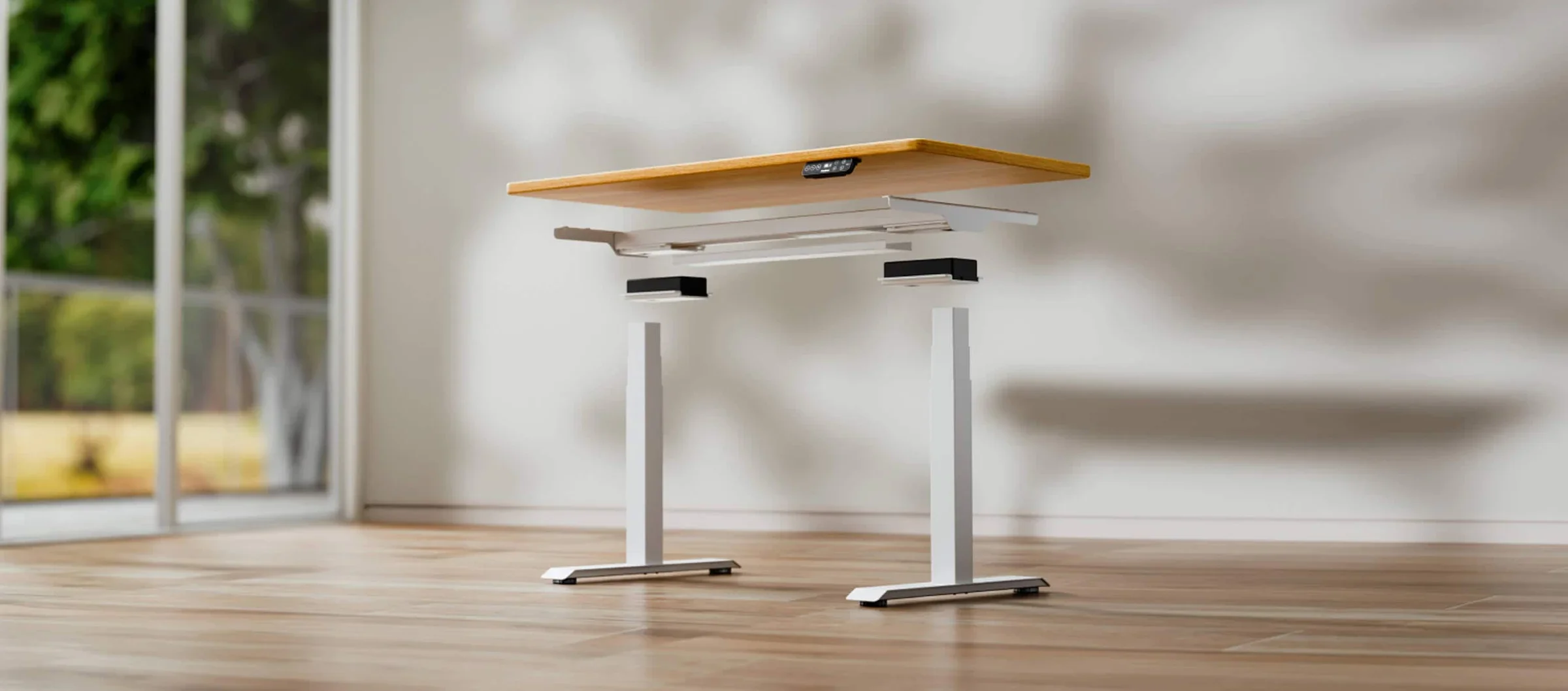 Very wide render of a white E7 frame exploded into top, crossbeam, motor housings and legs with a bamboo top floating above, in a sunlit room with leaf shadows; no text.