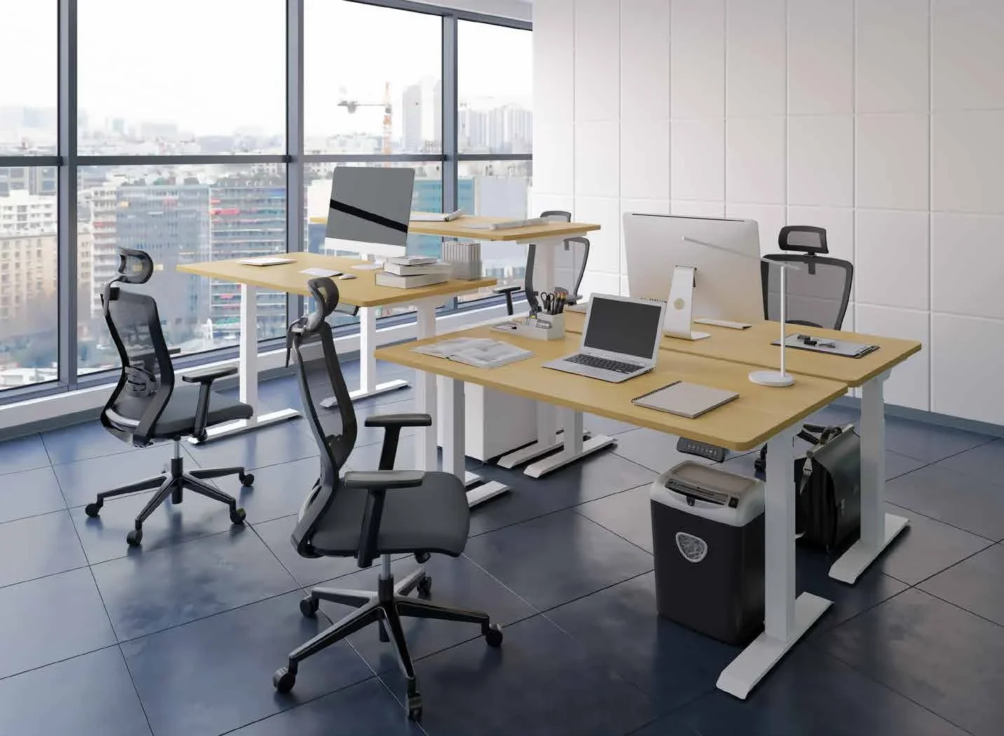 Open-plan office with three white-frame desks with oak-look tops, mesh chairs, monitors and laptops, grey tiled floor and a city view through floor-to-ceiling windows.
